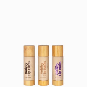 May include: Three wooden lip balm tubes with a purple and brown label that reads "Buttery Lip Balm" and a flavour name below. The flavours are Coconut Cream, Brown Sugar, and Vanilla Mint.