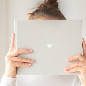 light gray guest book made of linen | HEART | White embossing