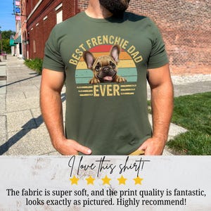 May include: A green t-shirt with a vintage-style graphic of a French bulldog. The graphic says "Best Frenchie Dad Ever".