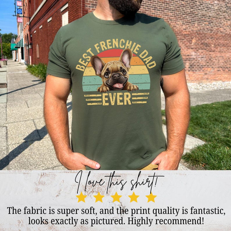 May include: A green t-shirt with a vintage-style graphic of a French bulldog. The graphic says "Best Frenchie Dad Ever".
