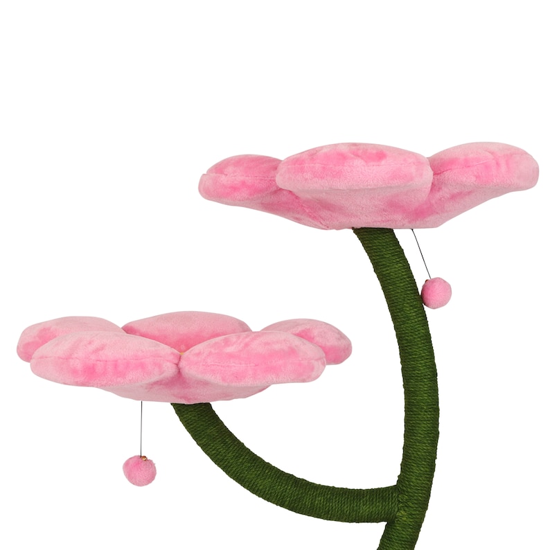 May include: Pink cat tree with two flower-shaped platforms and a green sisal-covered post. The platforms are made of soft plush and have a dangling toy.