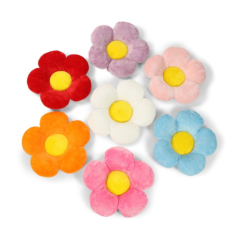 May include: Seven plush flower-shaped cushions in different colors, including red, orange, yellow, white, light blue, pink, and purple. Each cushion has a yellow center.