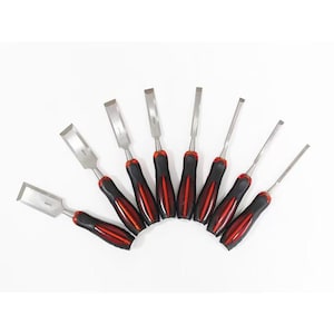 May include: A set of eight wood chisels arranged in a fan shape. Each tool features a polished metal blade and a black handle with a red centre stripe. The blades vary in width, and each is stamped with its specific size measurement in millimetres.