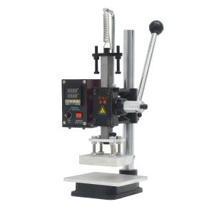 May include: A black and silver industrial heat press machine featuring a digital temperature control box with a red power switch, a vertical metal support column, a manual lever handle, and a flat rectangular heating plate for pressing materials.