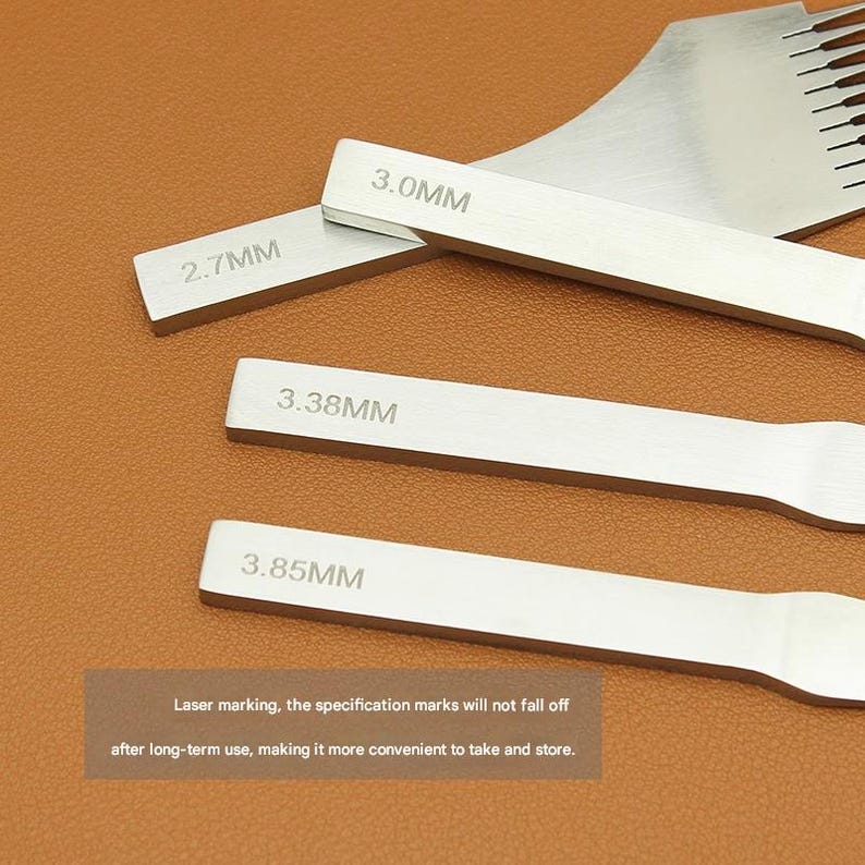 May include: Close-up of several silver leathercraft tools with measurements in millimeters: 2.7MM, 3.0MM, 3.38MM, and 3.85MM. The text "Laser marking, the specification marks will not fall off after long-term use, making it more convenient to take and store." is also visible.
