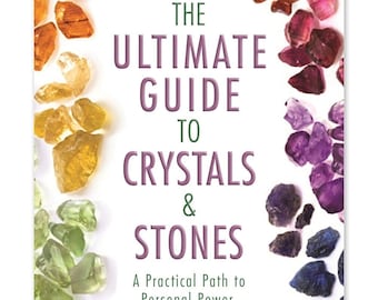 May include: Book cover with the title "The Ultimate Guide to Crystals & Stones: A Practical Path to Personal Power, Self-Development, and Healing" by Uma Silbey. The cover features a white background with a colorful border of various crystals and stones.