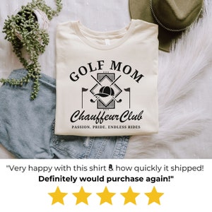 Flat-lay of white “Golf Mom Chauffeur Club” shirt with star review overlay. Cozy cotton golf mom t-shirt, customer favorite for gifts and everyday wear.
