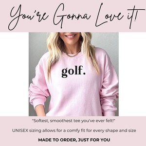Lady wearing a pink “golf.” sweatshirt with review overlay — soft and comfy design loved by buyers.