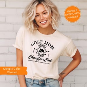 Woman wearing cream “Golf Mom Chauffeur Club” t-shirt with golf clubs graphic. Funny golf mom shirt, casual outfit for women who love golf or support golfers.