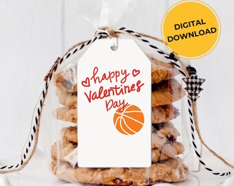 May include: A cellophane bag tied with twine contains a stack of cookies. A white tag with the words "happy Valentines Day" and a basketball graphic is attached. A yellow circle with "DIGITAL DOWNLOAD" is in the background.
