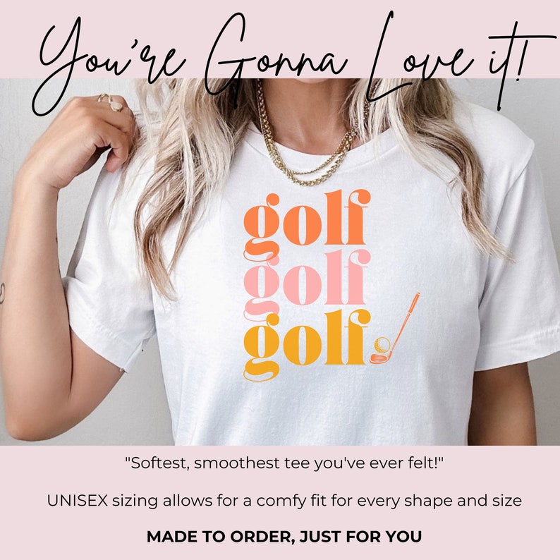 May include: White t-shirt with the word "golf" repeated three times in stacked, overlapping, colorful text. The top word is orange, the middle word is pink, and the bottom word is yellow. A golf club and ball are to the right of the text.