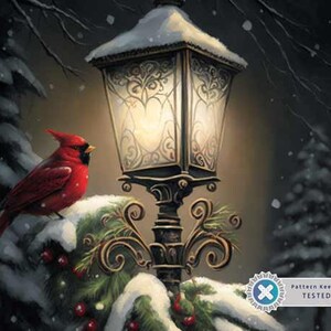May include: A red cardinal bird perched on a snow-covered branch with a vintage-style street lamp lit up in the background. The lamppost is decorated with ornate metalwork and has a snow-covered roof.