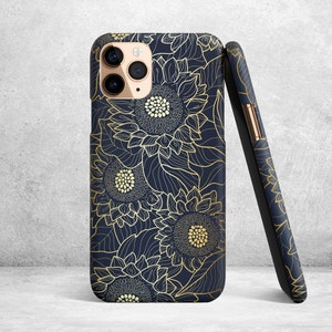 May include: A navy blue phone case with a gold floral design featuring sunflowers. The case has a cutout for the phone's camera.