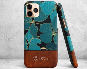 May include: A teal and gold floral phone case with a brown wood-grain bottom and the name "Beatrice" written in white script.