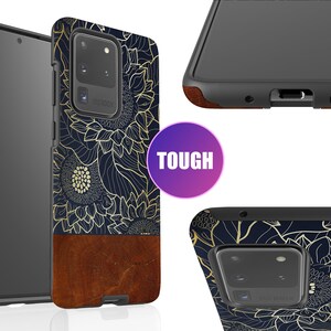May include: A black phone case with a gold floral design and a brown leather accent. The case is labeled "TOUGH".