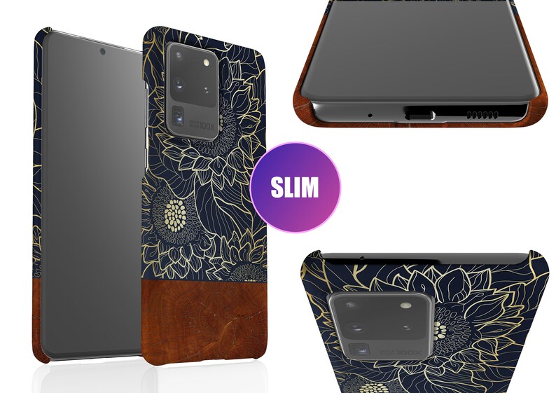 May include: A slim phone case with a navy blue background and a gold floral design. The case has a brown leather bottom and a cutout for the camera lens.