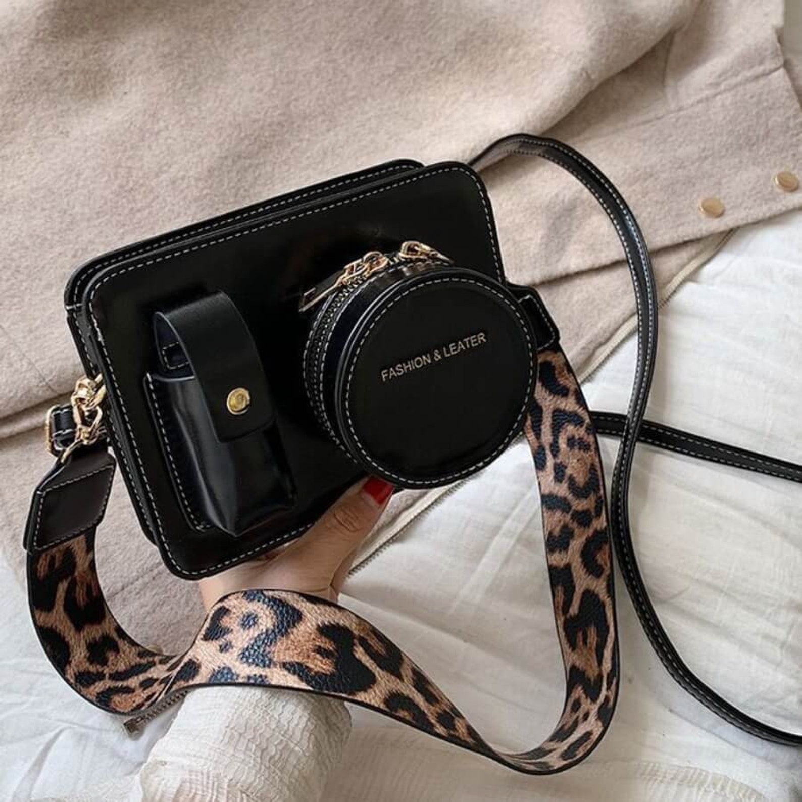 black bag with leopard print strap