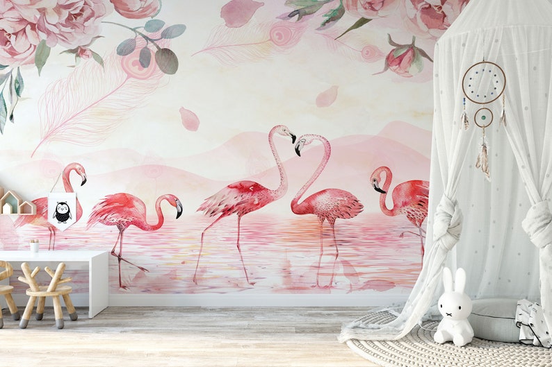 May include: Pink watercolour mural featuring a flock of pink flamingos standing in a pink lake with a pink and white floral design in the top left corner.
