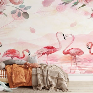 May include: A watercolour mural featuring pink flamingos standing in a pink lake with a pink and white floral design at the top. The mural is in a child's bedroom with a wooden bed and a brown blanket.