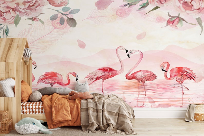 May include: A watercolour mural featuring pink flamingos standing in a pink lake with a pink and white floral design at the top. The mural is in a child's bedroom with a wooden bed and a brown blanket.