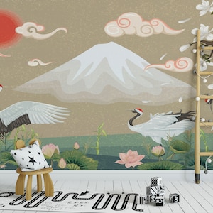 May include: A whimsical nursery wall mural featuring a Japanese mountain landscape with white cranes flying over a pond with pink lotus flowers. The mural also includes a red sun and white clouds.