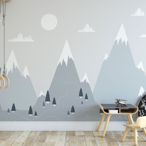 Snow-Capped Mountains and Evergreen Forest with Clouds and Sun Wallpaper