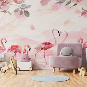 May include: A pink and white nursery with a pink armchair, a wooden toy tricycle, and a white toy chest. The wall is decorated with a pink and white watercolour mural featuring pink flamingos and pink roses.