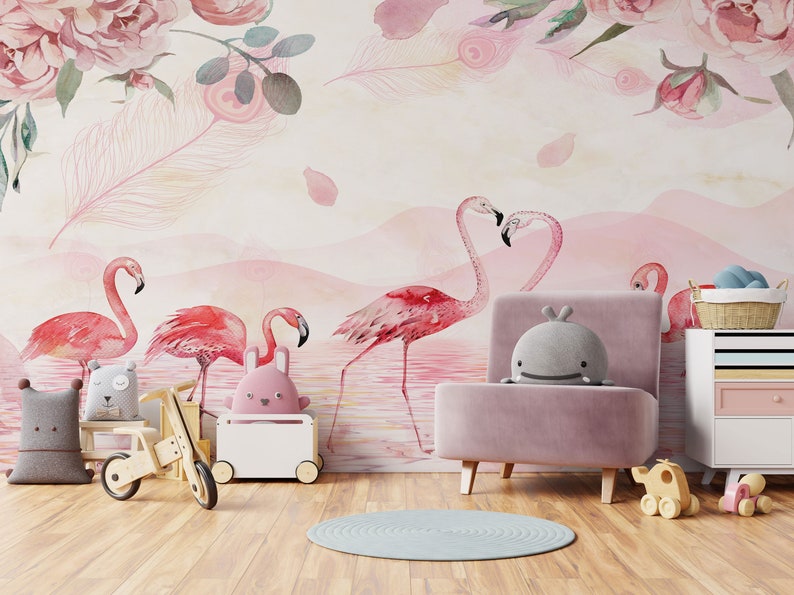 May include: A pink and white nursery with a pink armchair, a wooden toy tricycle, and a white toy chest. The wall is decorated with a pink and white watercolour mural featuring pink flamingos and pink roses.