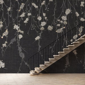 May include: A black and white floral wallpaper with a black and white bird design. A modern staircase with black metal railings is in the foreground.