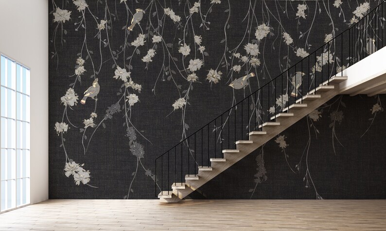 May include: A black and white floral wallpaper with a black and white bird design. A modern staircase with black metal railings is in the foreground.