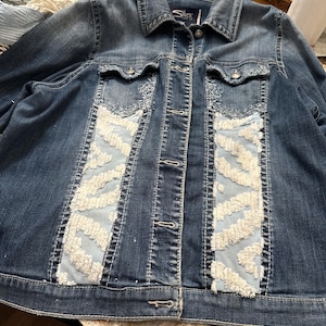 Denim Jacket customized with Chenille. This jacket is super soft and stretchy. The buttons are scrolled and very fancy.