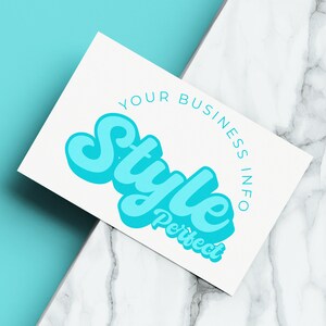 May include: A white business card with the text "Your Business Info" and the word "Style" in a blue, 3D, stylized font. The word "Perfect" is written below "Style" in a smaller font.