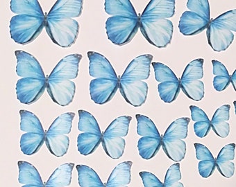 18 blue wafer paper butterflies. Precut. Edible topper for cake and cupcake decorating.  B27