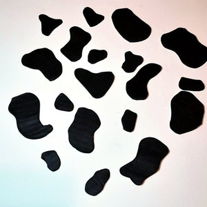 Fondant cow spots cake topper
