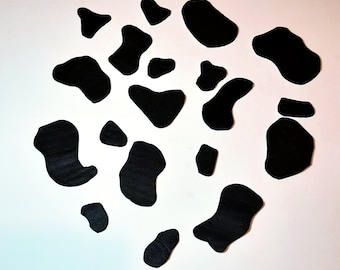 Fondant cow spots cake topper