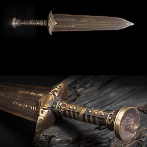May include: A bronze-colored sword with a detailed handle and blade. The handle features intricate designs and a rounded pommel. The blade has a pointed tip and etched patterns. The sword is displayed against a dark background.