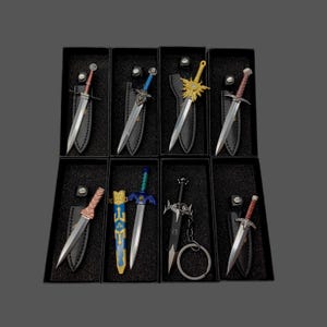 May include: A collection of miniature decorative swords in black display boxes. Each sword has a unique design, with silver blades and various handle colors, including red, blue, and gold. The swords are displayed with black sheaths.