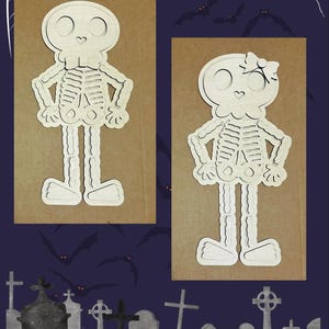 May include: Two wooden skeleton cutouts, one with a bow, on a brown background. The skeletons have detailed rib cages, arms at their sides, and large feet. The background is a dark blue with bats and a graveyard scene.