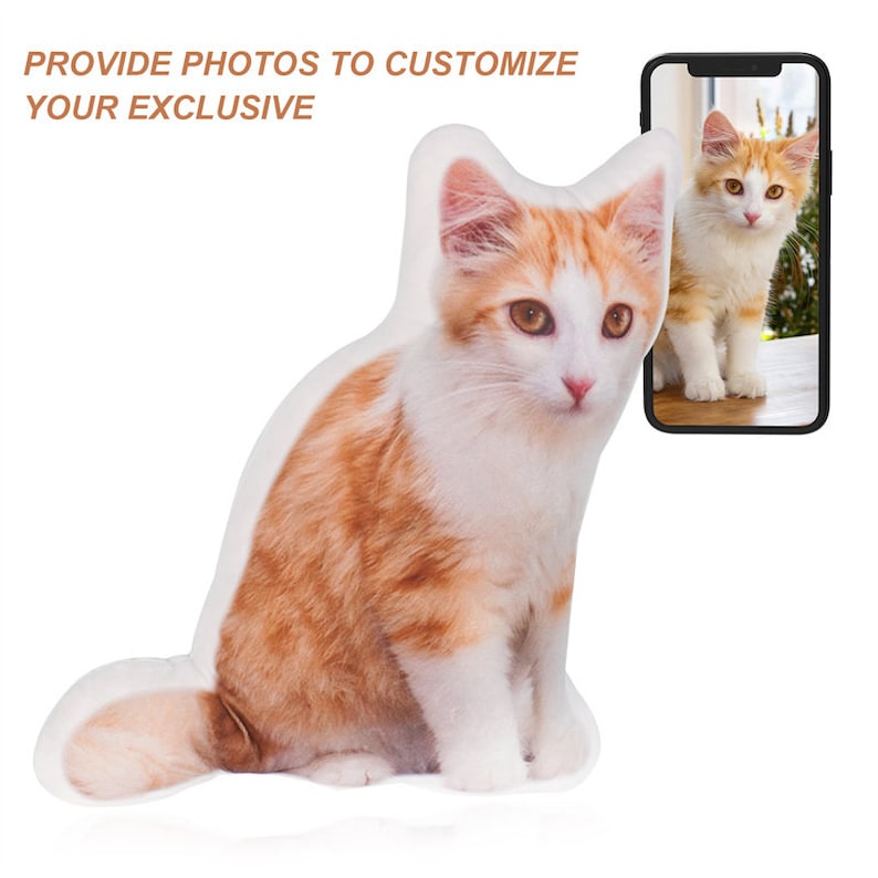 May include: A plush cat pillow with a white and orange tabby cat design. The pillow is sitting on a white surface. The image includes the text "Provide photos to customize your exclusive".
