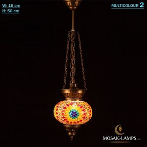 May include: A colourful mosaic glass pendant light with a gold metal frame and chain. The light is 16 cm wide and 50 cm tall.  MULTICOLOUR 2