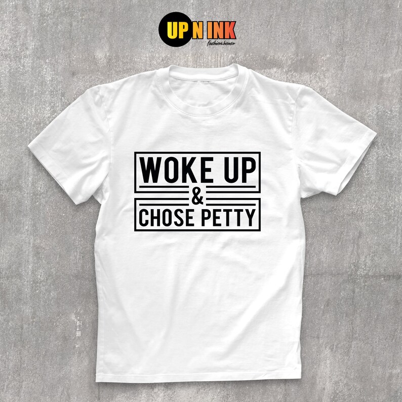 May include: White t-shirt with black text that reads "Woke Up & Chose Petty" in a bold, rectangular box.