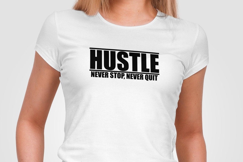 May include: White t-shirt with black text that reads "Hustle Never Stop, Never Quit"