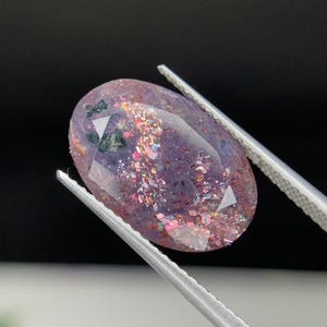 Natural Multi Flakes Bloodshot Iolite Sunstone 4.89 Carat 15.8x10.6 MM Oval Shape Faceted Gemstone