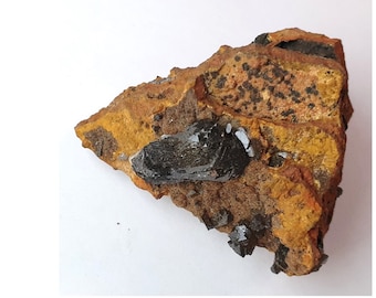 Pink (black) Adamite specimen on limonite from the Ojuella Mine, Mexico