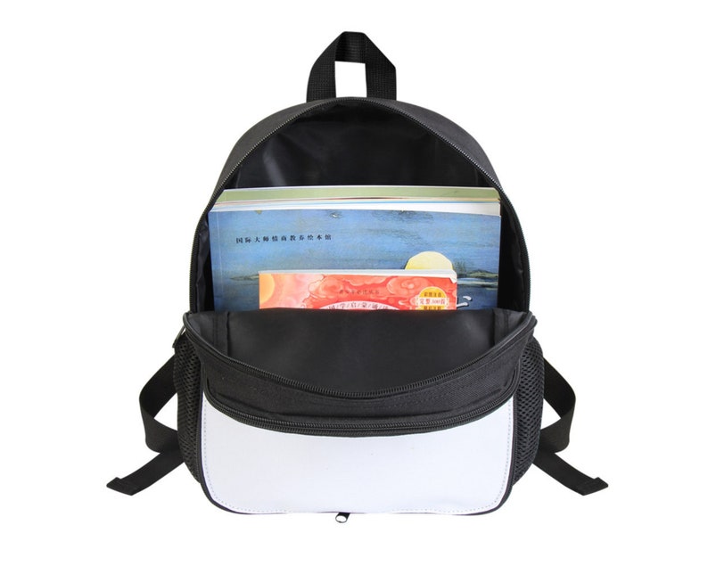 May include: A black and white backpack with a zippered front pocket. The backpack is open and has books inside.