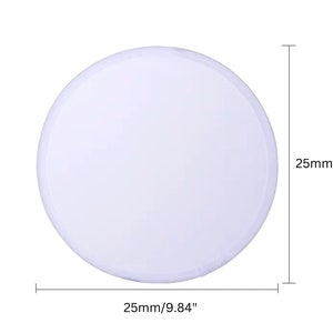 May include: A white, circular object with a diameter of 0.98 inches. The object is shown against a white background. The dimensions are clearly labeled on the image.
