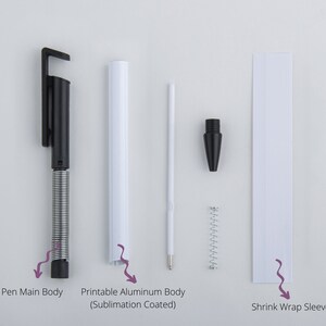 May include: A disassembled set of parts for a black and white retractable pen. The parts include the pen main body, a printable aluminum body, a shrink wrap sleeve, a spring, and a pen tip.
