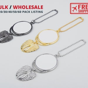 May include: Three silver, gold, and black keychains with a round mirror and angel wings. The keychains are available in bulk or wholesale packs of 10, 20, 30, 40, 50, or 60.
