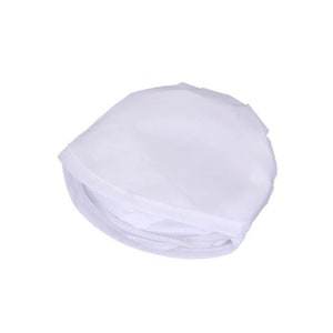 May include: A folded, white, semi-transparent fabric item, possibly a garment or accessory, against a white background. The fabric appears to be lightweight and has a slightly wrinkled texture. The item is folded into a compact shape.