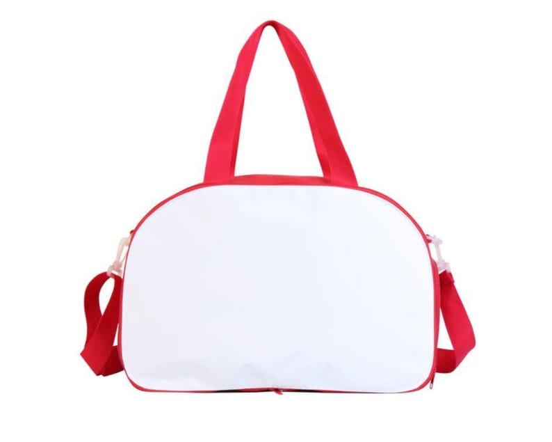 May include: A white canvas duffel bag with red trim and red straps. The bag has a zipper closure.